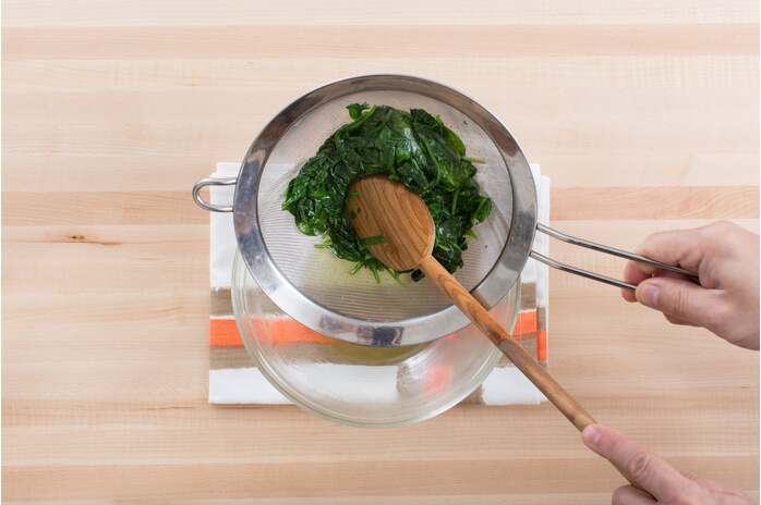 recipe-step-image-Cook & drain the spinach: