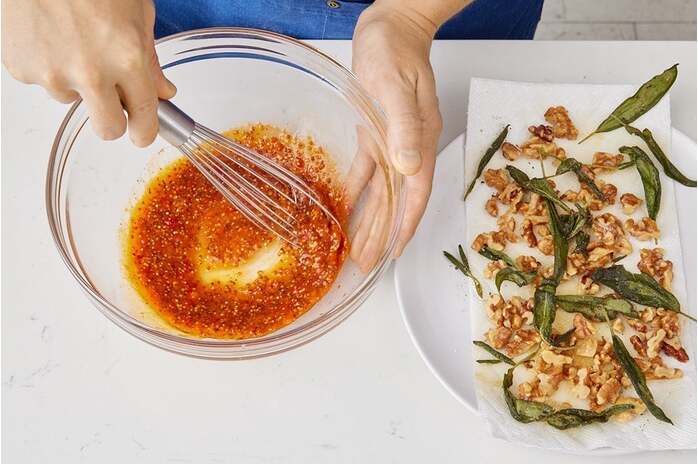 recipe-step-image-Toast the walnuts & make the vinaigrette