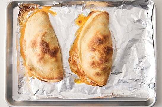 recipe-step-image-Bake the calzones & serve your dish