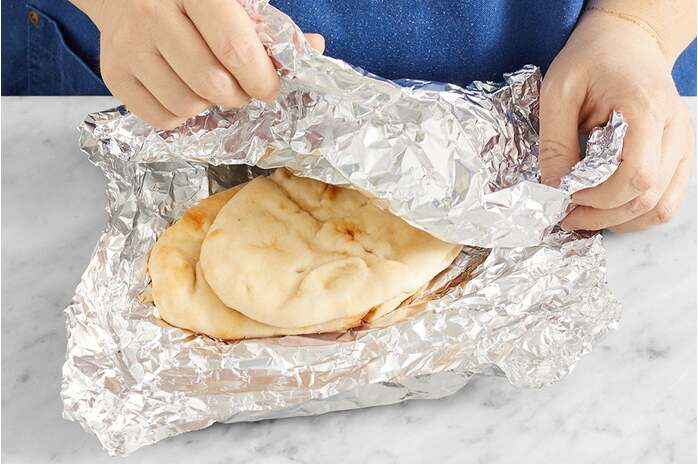 recipe-step-image-Warm the naan & serve your dish