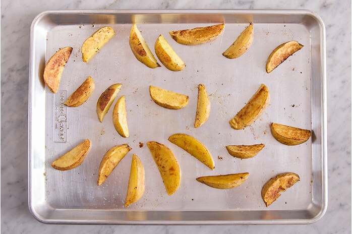 recipe-step-image-Roast the potato wedges 
