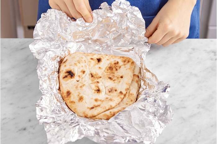 recipe-step-image-Warm the naan & serve your dish
