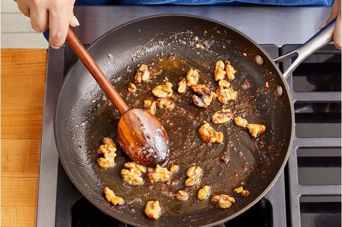 recipe-step-image-Make the brown butter pecans & finish the dressing