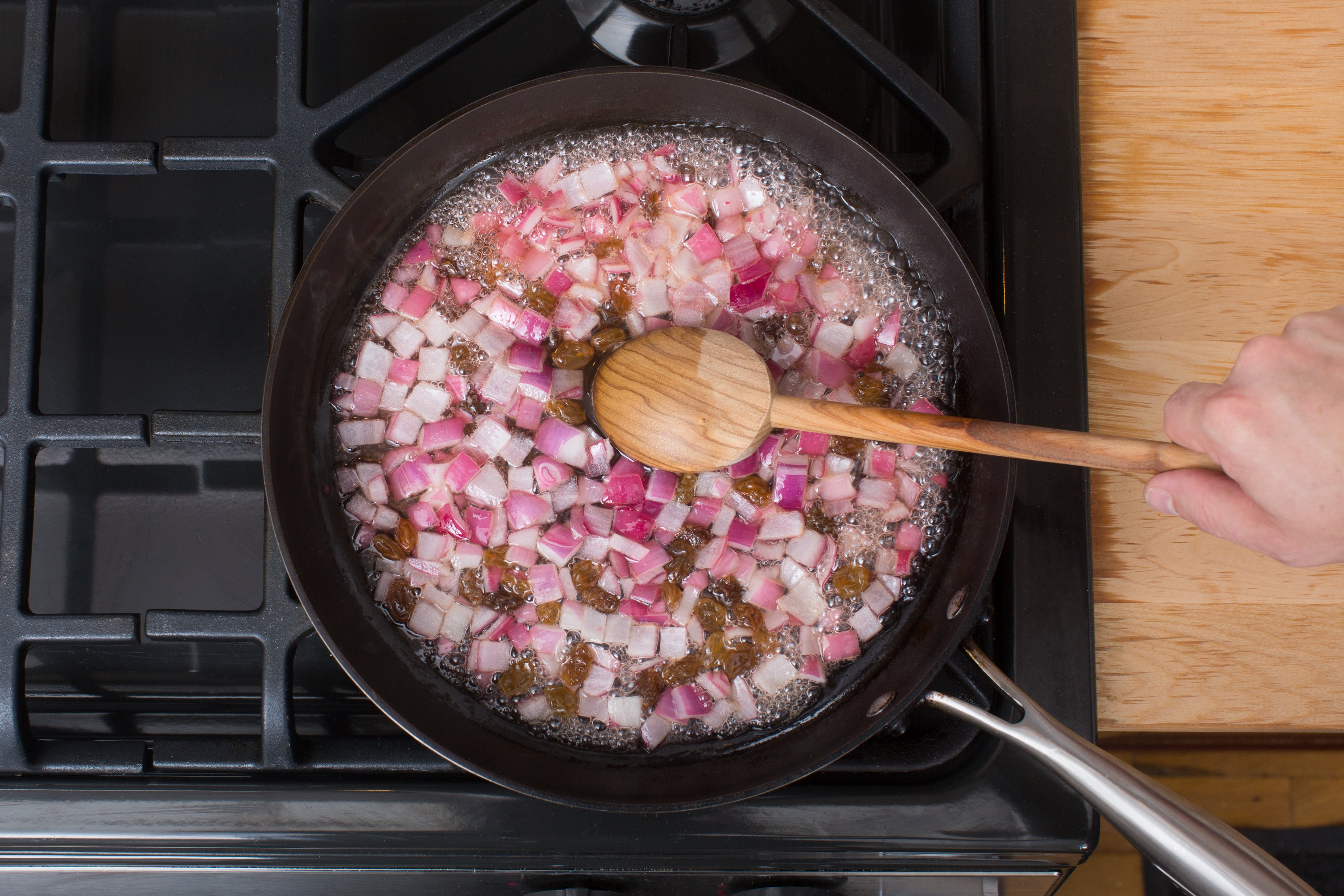 recipe-step-image-Pickle the onion & raisins}