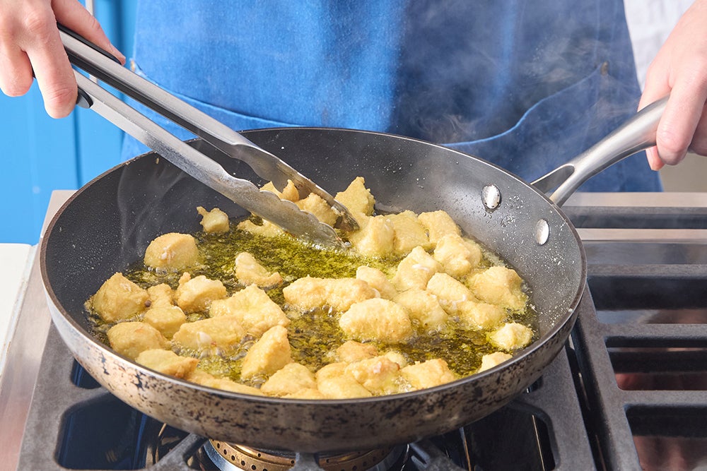 recipe-step-image-Coat & cook the chicken}