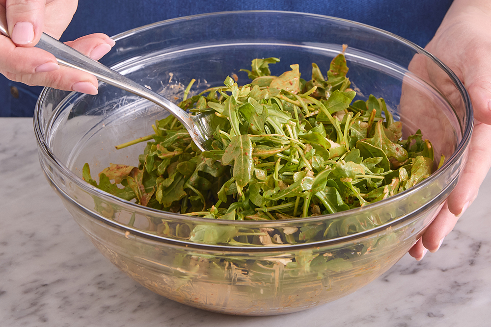 recipe-step-image-Prepare & dress the arugula}