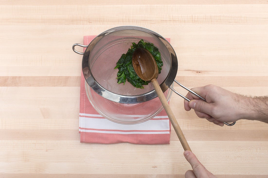 recipe-step-image-Cook & drain the spinach:}