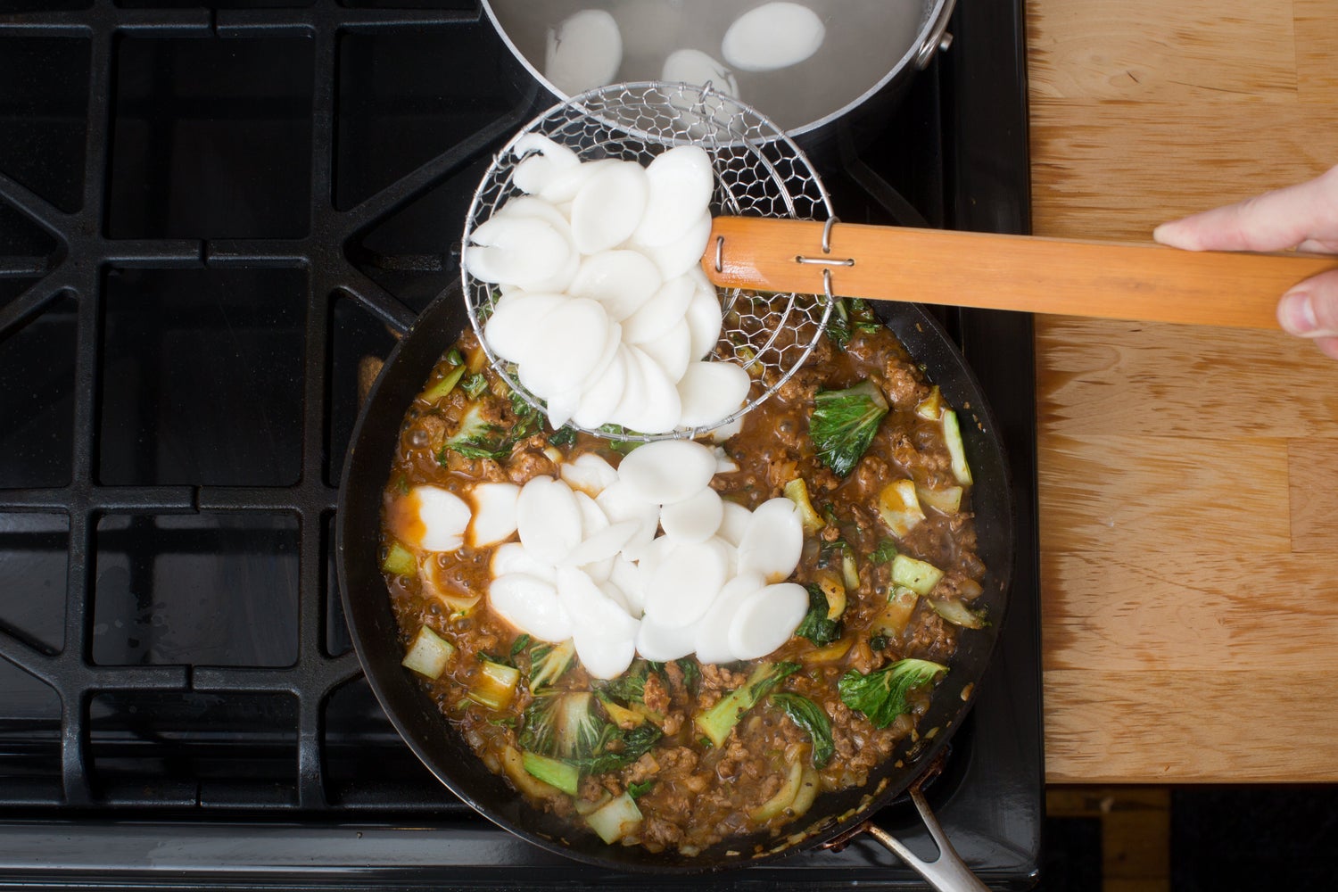 recipe-step-image-Cook & add the rice cakes:}