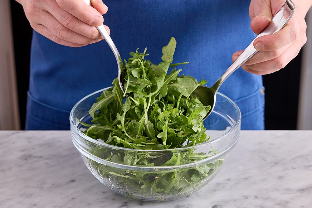 recipe-step-image-Dress the arugula & serve your dish}