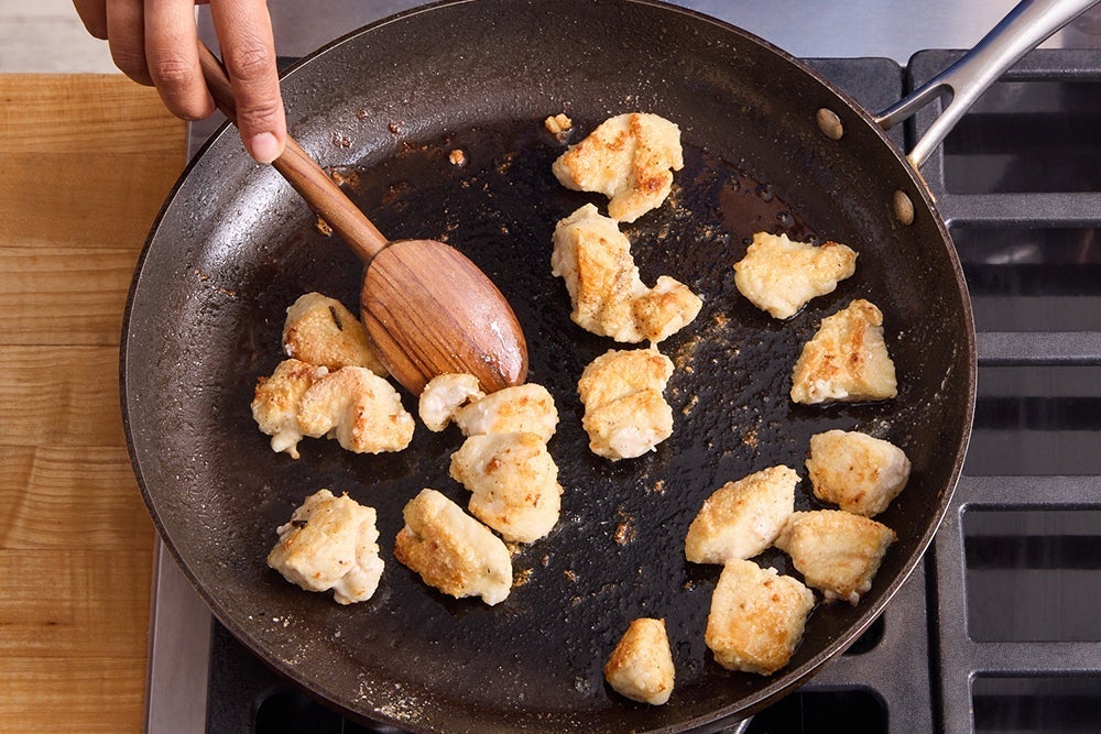 recipe-step-image-Coat & cook the chicken }