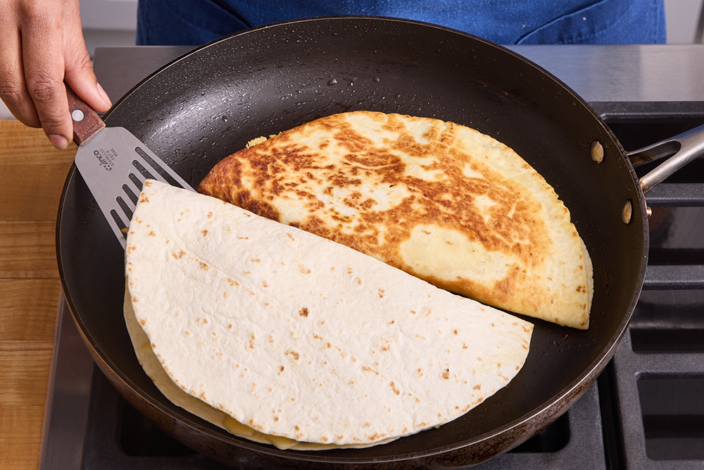 recipe-step-image-Cook the quesadillas & serve your dish }