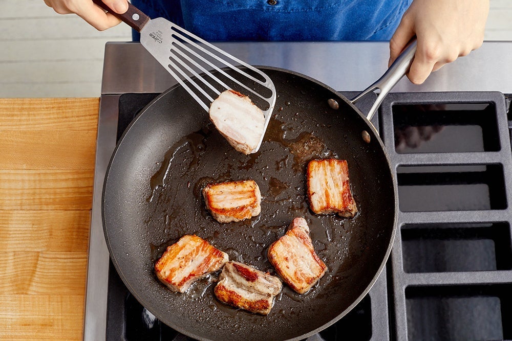 recipe-step-image-Slice & brown the pork belly }