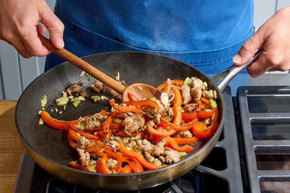 recipe-step-image-Cook the pork & pepper}