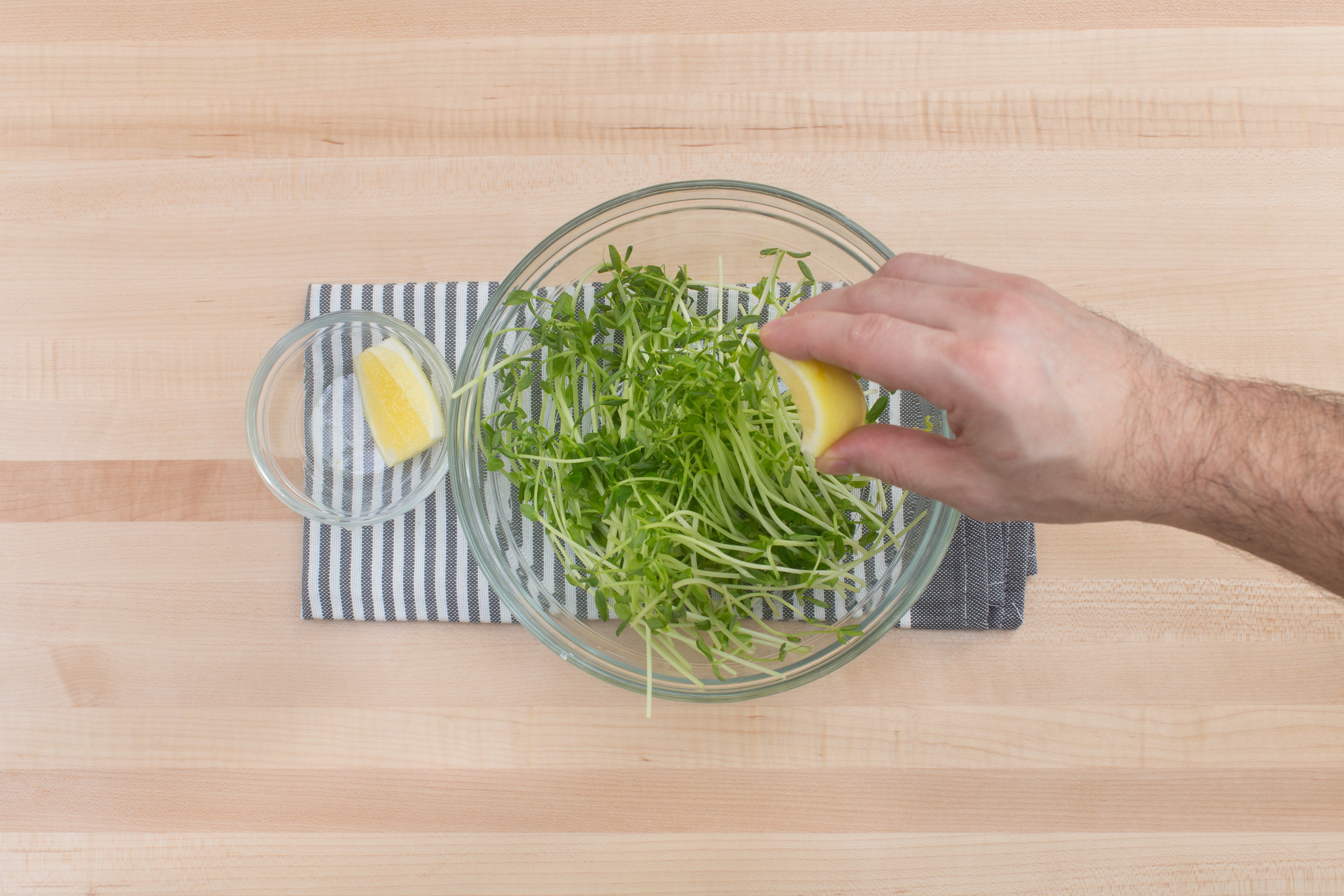 recipe-step-image-Dress the pea shoots: }