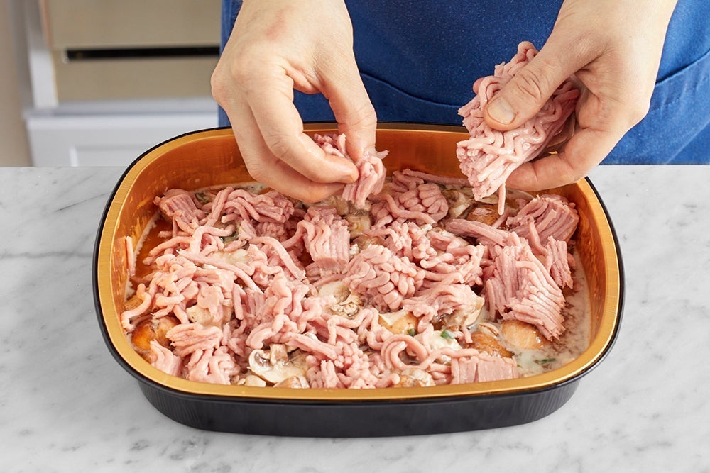 recipe-step-image-Add the turkey and bake the tray}