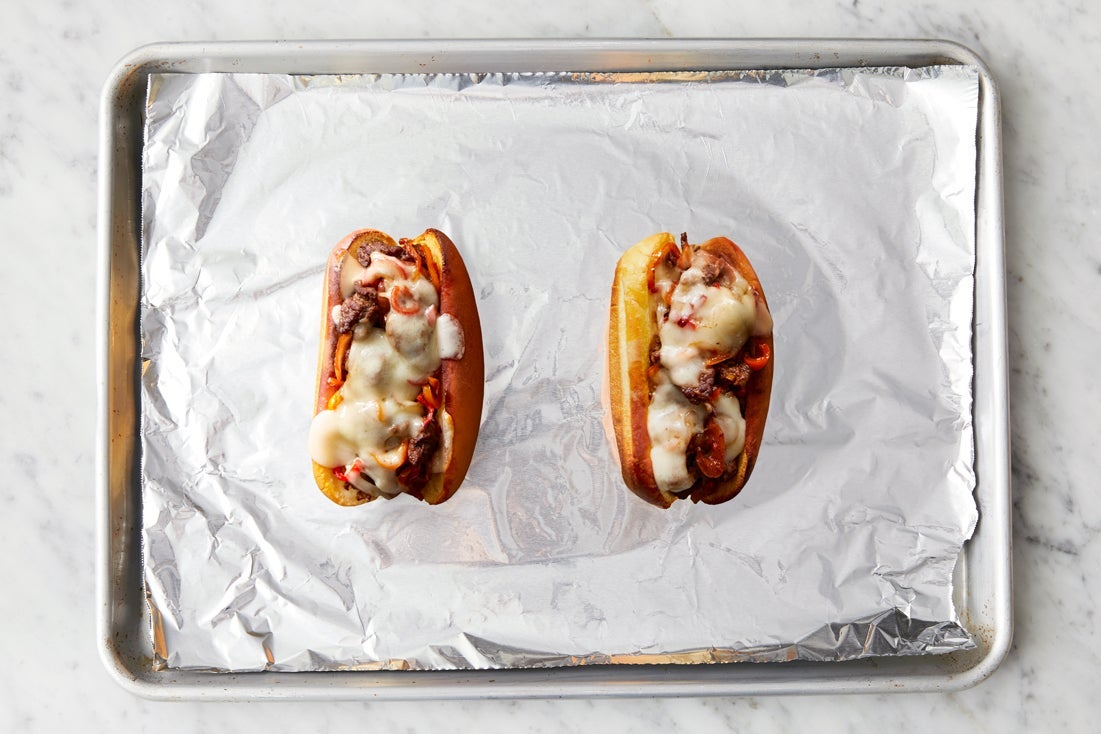 recipe-step-image-Finish the cheesesteaks & serve your dish:}