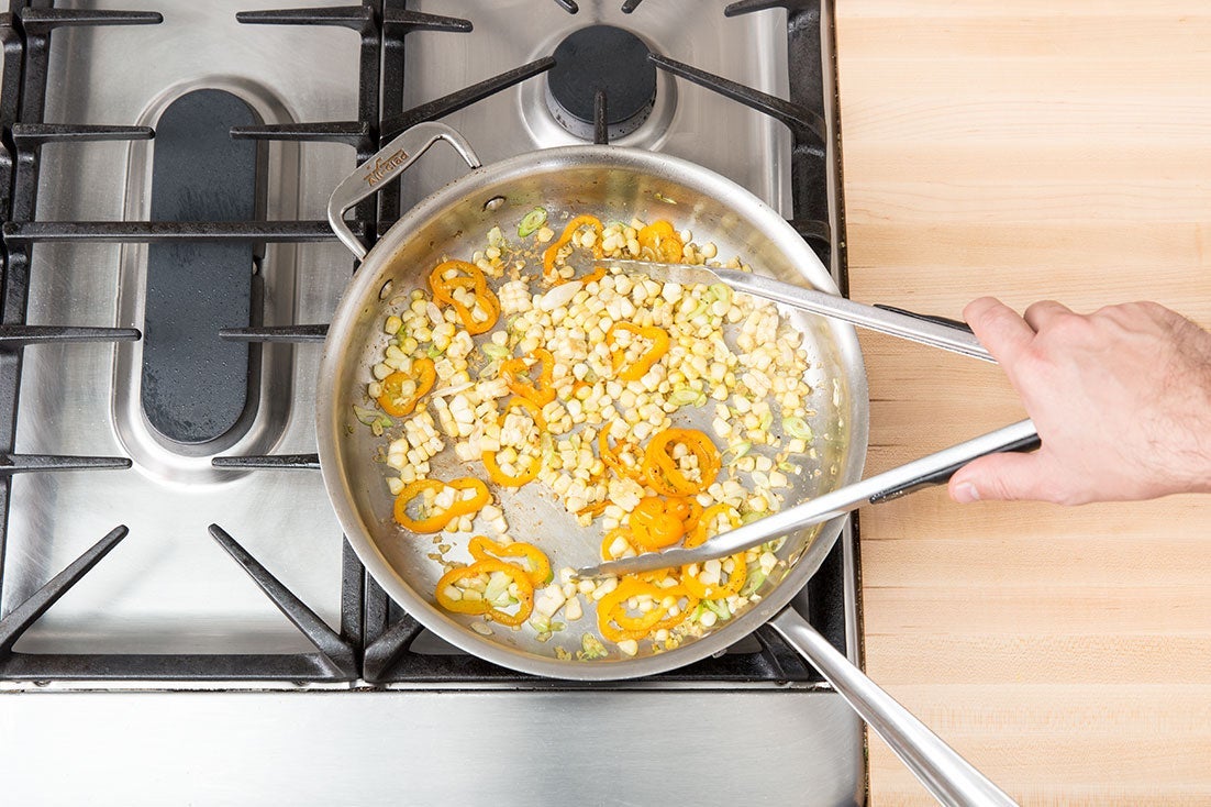 recipe-step-image-Add the corn & aromatics:}