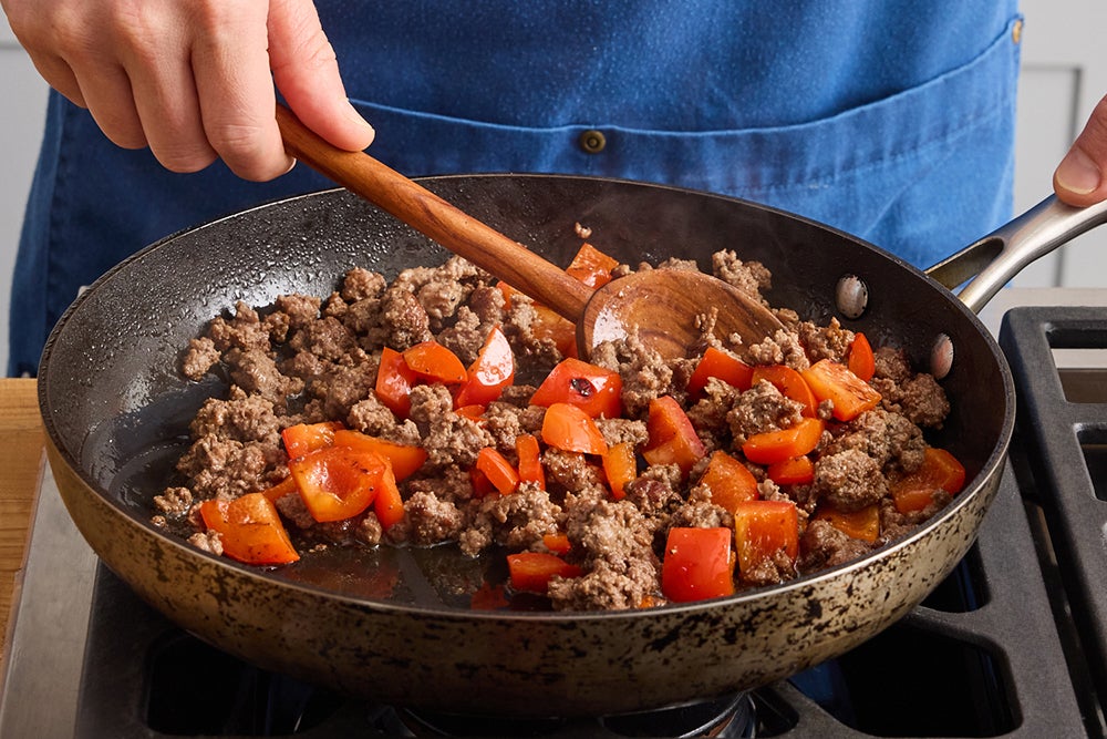 recipe-step-image-Cook the pork & pepper}