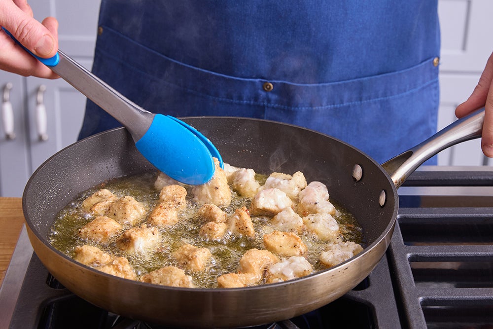 recipe-step-image-Coat, cook & dress the chicken}