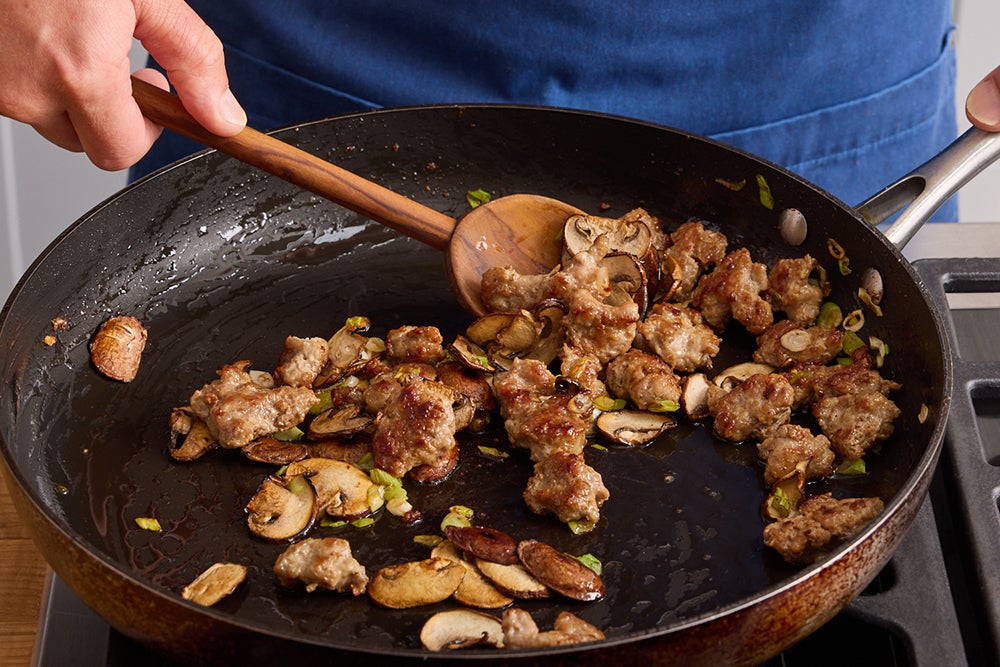 recipe-step-image-Cook the pork & mushrooms}