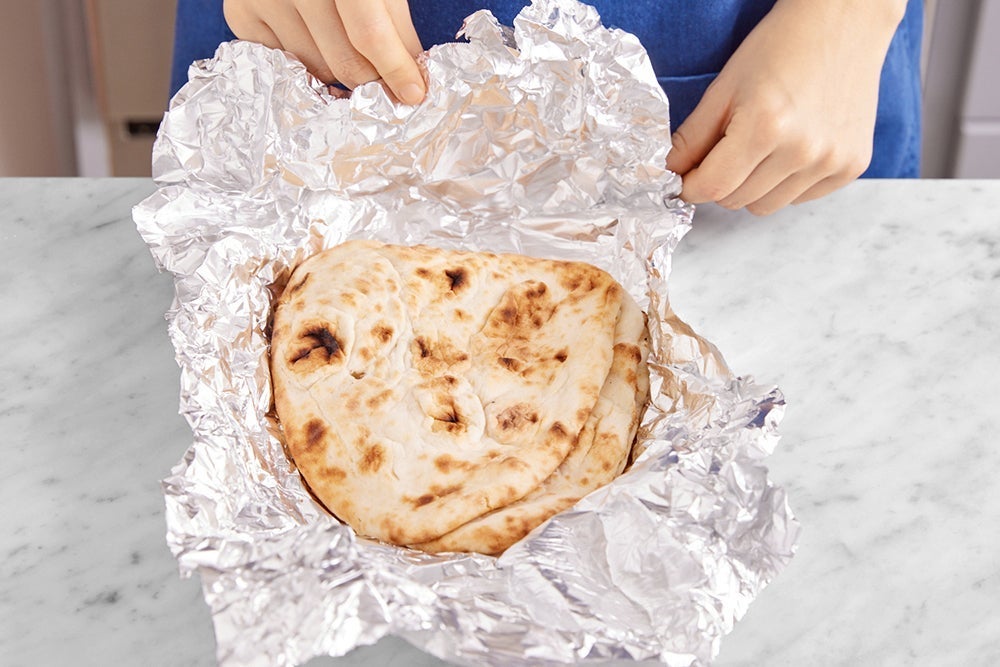 recipe-step-image-Warm the naan & serve your dish}