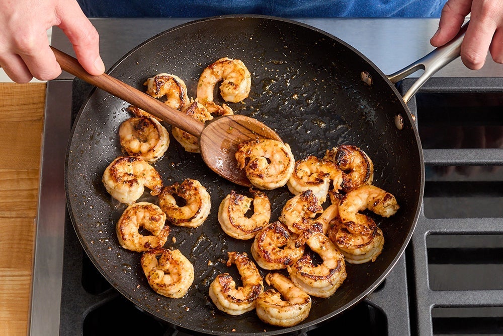 recipe-step-image-Cook the shrimp & serve your dish}