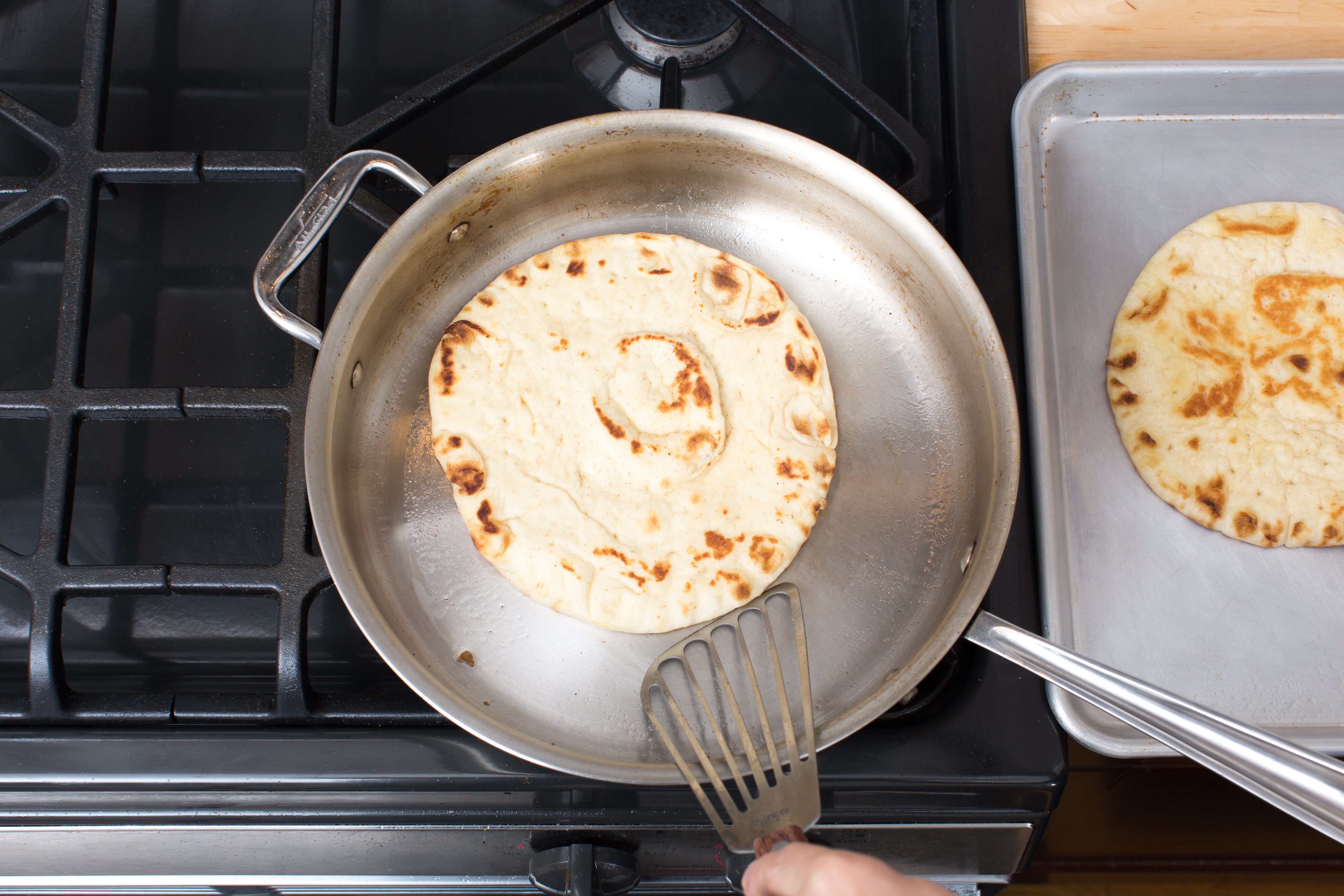 recipe-step-image-Warm the pitas:}
