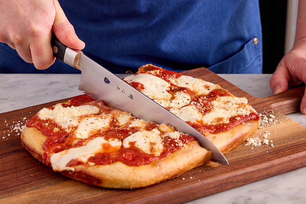 recipe-step-image-Finish the pizza & serve your dish}