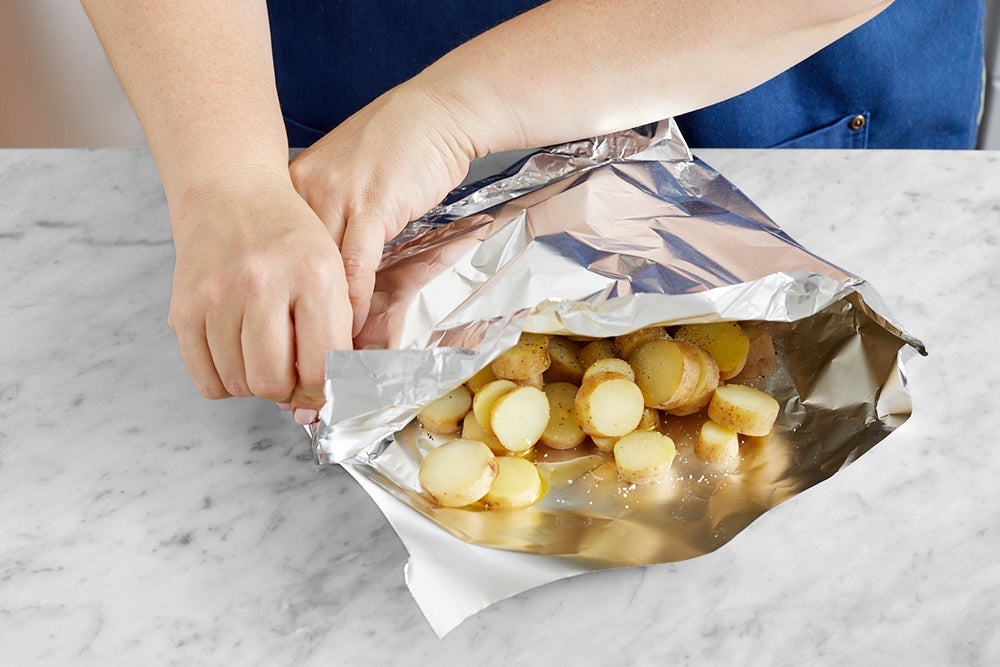 recipe-step-image-Assemble the foil packet & grill the potatoes}